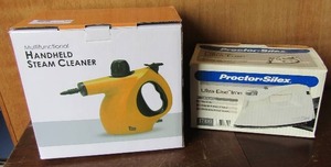 lot 130 image: Hand held steam cleaner NIB, used ultra light iron in original box