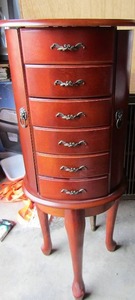 lot 133 image: Cherry wood long leg jewelry box with 5 drawers and 2 sides that open plus top lifts, very beautiful piece 34 X 13 X 10
