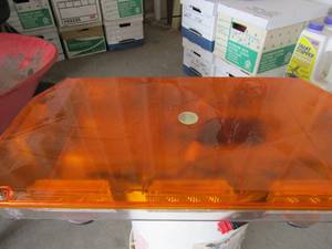 lot 144 image: Orange emergency light that attaches to the top of vehicle with plug for cig lighter, works great