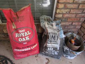 lot 908 image: new and used bags of charcoal, 2 metal buckets and a box of matches