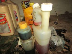 lot 1029 image: various lubricants and 2 cycle engine oil- chain saw chain