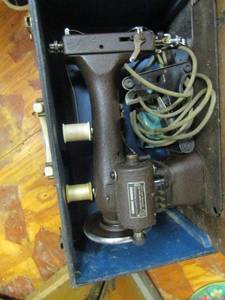 lot 1064 image: black case with a sewing machine inside- brand unknown