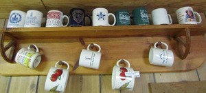lot 1071 image: wall mounted wooden shelf made to hold coffee cups, also comes with 14 cups