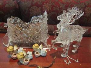 lot 1154 image: plastic Santa sleigh with acorns inside, 2 plastic Santa reindeer, 3 mini angel candle holders