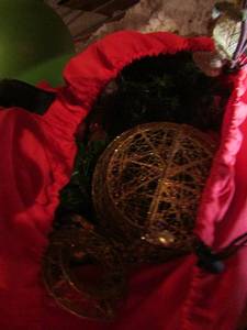 lot 1208 image: red bag full of fancy garland and large Christmas tree bulbs