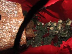 lot 1209 image: red bag of high end garland and wooden Christmas dcor bird feeders