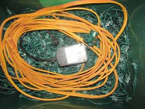 lot 1215 image: green tub full of Christmas lights qty 8 rolls plus, yellow extension cord