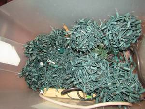 lot 1216 image: green tub full of Christmas lights approx. 8 rolls
