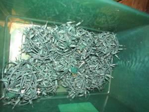 lot 1218 image: green tub full of Christmas lights qty 8 rolls approx.