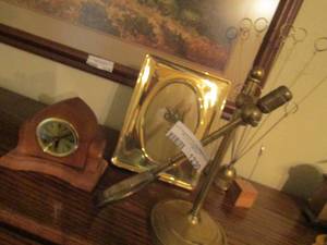 lot 1230 image: solid brass 5x7 photo frame, table top clock, magnifying glass on stand, picture holders