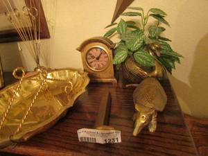 lot 1231 image: brass lot includes rail road nail, armadillo, goose with fake leaves and a clock