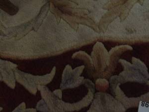 lot 1198 image: maroon and cream color oval dining rug
