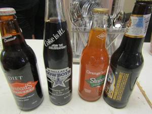 lot 1185 image: Dallas cowboy Coke bottle-- Stewarts orange and cram soda, root beer by Stewart & Virgil all vintage qty 4 not opened