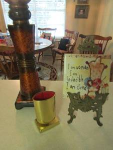 lot 1266 image: I am women stand with tile-- Gold eye glass holder