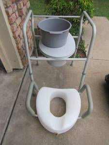 lot 1324 image: potty chair with pot and a toilet seat riser