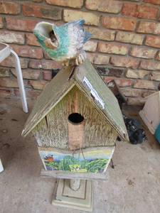 lot 896 image: Wooden bird house in stand