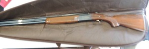 lot 1111 image: BREDA 12 GAUGE OVERUNDER SHOTGUN Modified  choke  ( HAS SOME RUST see pics ) IN CASE