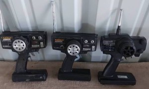 lot 13 image: 2 Magnum Juniors and 1 Magnum Sport Wheel Type RC Transmitters--Unknown working condition