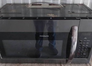 lot 219 image: Frigidaire Above Range Microwave--Powers on but does not heat up--Needs to be scrubbed