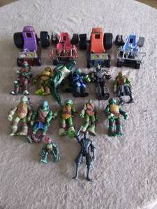 lot 65 image: Lot of Teenage Mutant Ninja Turtles Action Figures and Accessories--See pics, one turtle has broken arm