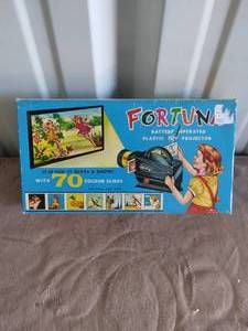 lot 14 image: Fortuna Plastic Toy Projector with Slides--Unknown Working Order