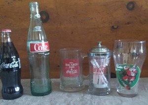 lot 123 image: Selection of Misc. Coca Cola Collectable Glass ware---Including Bottles, Straw Holder, Santa Glass and Bacardi Mug