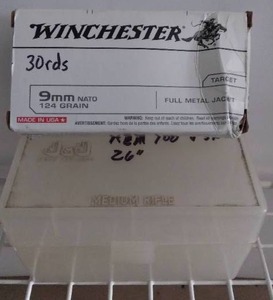 lot 171 image: 30 Rounds of Winchester 9mm Ammo and Empty Rifle Ammo Container