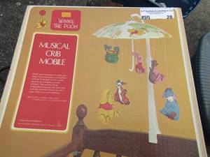 lot 28 image: Vintage musical Winnie the pooh crib mobile, all pieces are in box