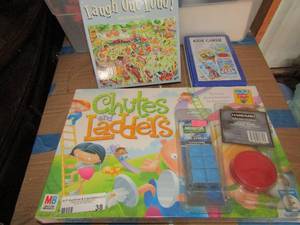 lot 38 image: Game lot includes, chutes and ladders- cue chalk new- hockey puck- kidz cardz- laugh out loud