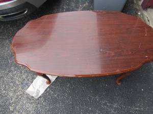 lot 47 image: Dark wooden rocker, small coffee table 154224, needs top repaired from stains
