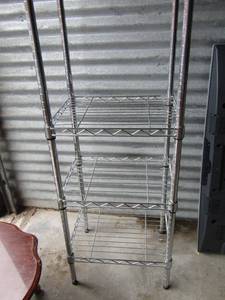 lot 49 image: 733614, metal shelf with long top for either hanging items or dcor