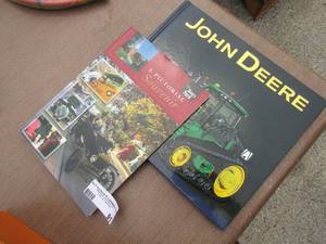 lot 91 image: A picture souvenir book- John Deere tractor book