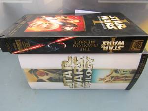 lot 122 image: Star wars movies set of 3 and one single one, VS. all seem to be in good shape