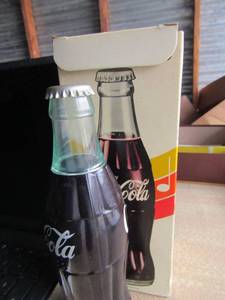 lot 131 image: Mintek  mini dvd player Model # MDP-5860-- vintage coca cola bottle radio in original packing, unknown working condition