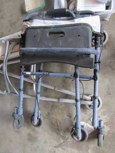 lot 134 image: 2 foldable adult size walkers, one is 2 wheeled and the other has 4 wheels both used condition