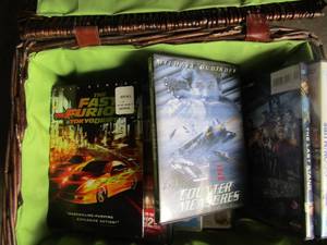 lot 135 image: wicker basket with front latches, also includes various action dvd movies qty 7