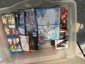lot 149 image: Clear tote full of dvd movies action- comedy- childrens movies and more, some are blue ray