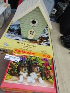 lot 179 image: Wolf harmony puzzle- Kodacolorr puppy puzzle-- bird house- Antiques road show game