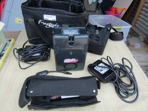 lot 180 image: Airzep portable oxygen machine with charger qty 2 hoses and nose cannulas not included, comes with caring bag- unknown working condition