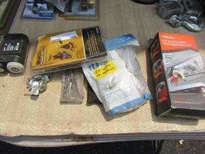 lot 188 image: Misc. lot of ryobi flash light- large hook clamp- multi fit replacement filters- 10 pack of satin nickel door  dresser knobs