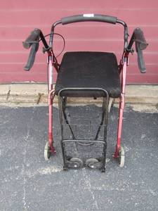 lot 203 image: 4 wheel foldable adult walker with seating and under storage- small folding black rolling cart