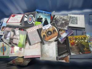 lot 214 image: Large lot of music cds includes kids songs, country, rock n roll- Hannah Montana, Christmas and more