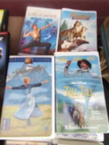 lot 216 image: large lot of vs. mostly Disney movies- lord of the dance- tall tail- Rudolf- Polly- princess bride and many more
