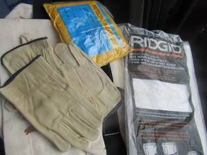 lot 228 image: RAIN COAT, 2 CLOTH WORK BAGS, 3 PAIR OF GLOVES AND 2 PACK OF PICK  UP DUST BAGS FOR SHOP VAC