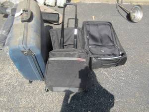 lot 237 image: 3 black luggage bags on wheels, 1 blue rolling suit case