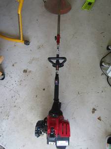 lot 8 image: Troy built gas operated weed eater, starts right up