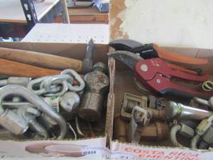 lot 21 image: large utility camps and locks, hand held fiskars and 2 hammers