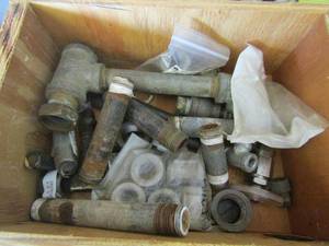 lot 100 image: wooden box of various piping pieces
