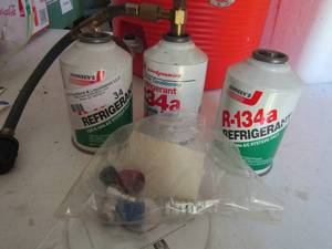 lot 34 image: r-134 a refrigerant with gauge and gauge pieces