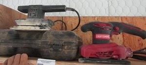 lot 180 image: black and decker finishing sander and a craftsman sander and 1 empty tool case